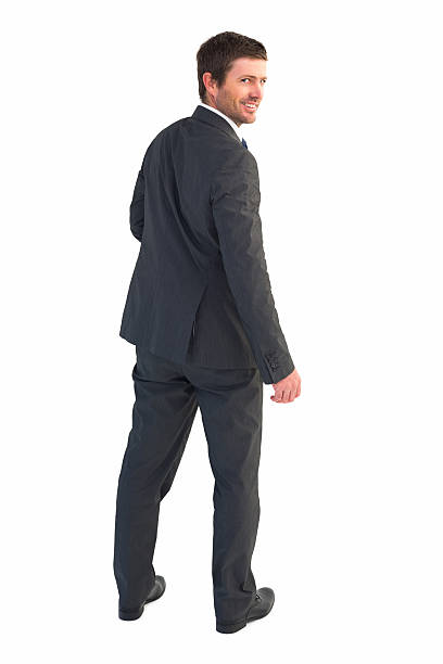 istock Businessman standing and smiling 528534281