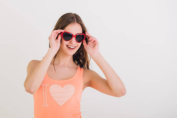 istock merry curly girl in funny glasses isolate 528551580