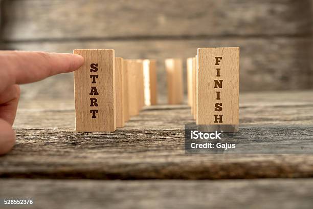 Dominos Standing In U Shape Stock Photo - Download Image Now - Beginnings, The End, Activity