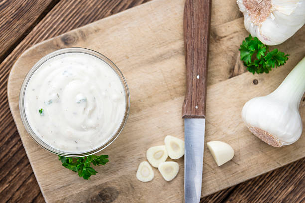istock Garlic Sauce with some fresh Herbs 528553288