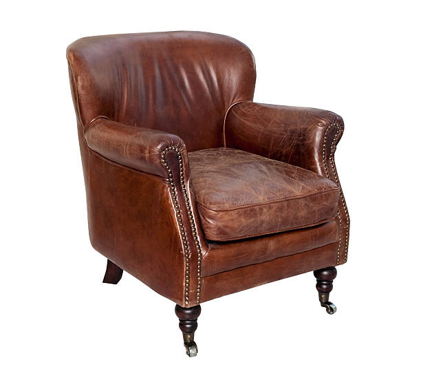 istock Vintage brown leather armchair isolated 528554444