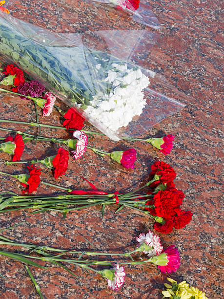 istock Flowers lie on a red granite 528554680