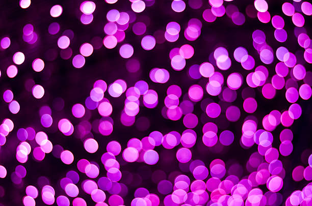 istock Defocused purple lights background photo 528556705