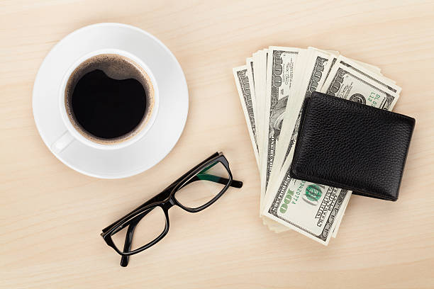 istock Money cash, glasses and coffee cup 528556845