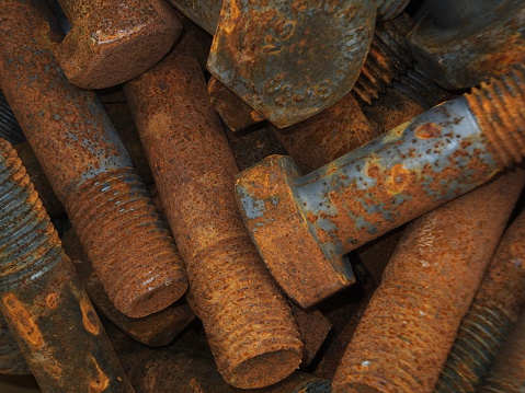 Close-up of large rusty bolts.