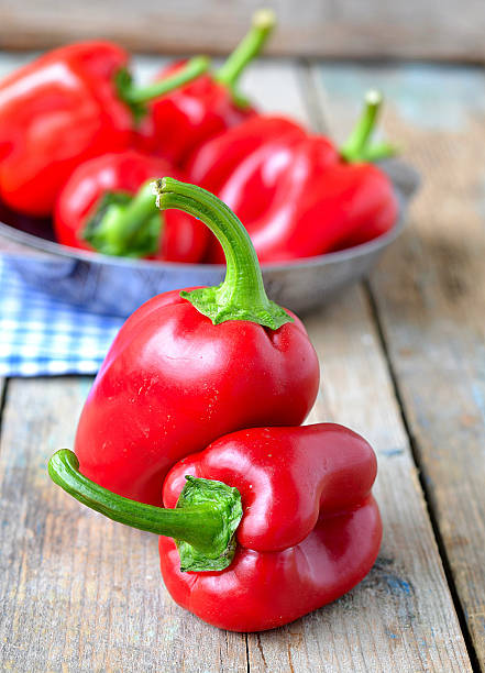 istock red pepper and parsley root on a wooden background.selective foc 528557707