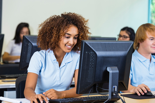 Diverse students in private school computer class