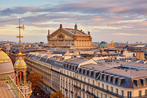 Beautiful Parisian skyline with Opera Garnier with dramatic colorful sunset