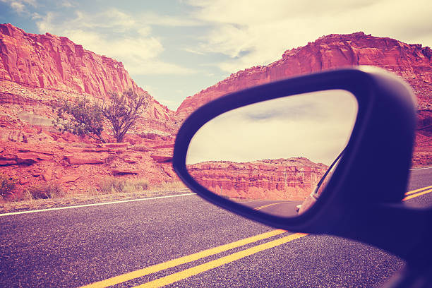 istock Vintage stylized car wing mirror, travel concept. 528558616