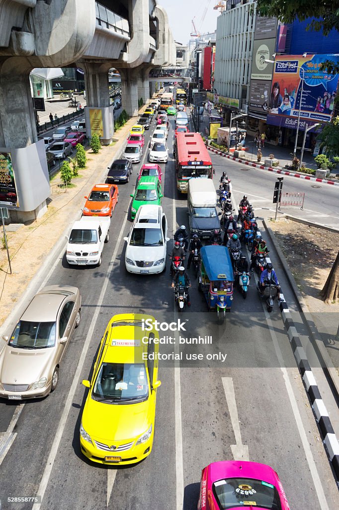 Bangkok - city traffic congestion on road in Bangkok Bangkok, Thailand - March 5, 2014: City traffic at a road junction in the Pathum Wan district. Car Stock Photo