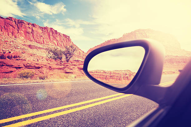 istock Vintage stylized car wing mirror with lens flare effect. 528558964