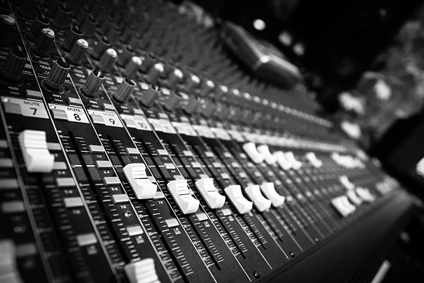 istock mixer, studio mixing board fader, close up 528559297