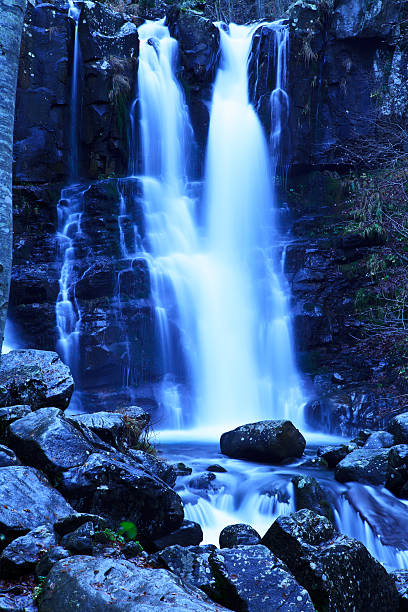 Waterfall through rocks stock photo