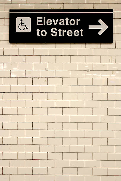 istock New York City Station subway directional sign on tile wall. 528560581