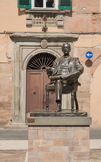 Bronze statue of Giacomo Puccini in his birth town Lucca, Tuscany, Italy 