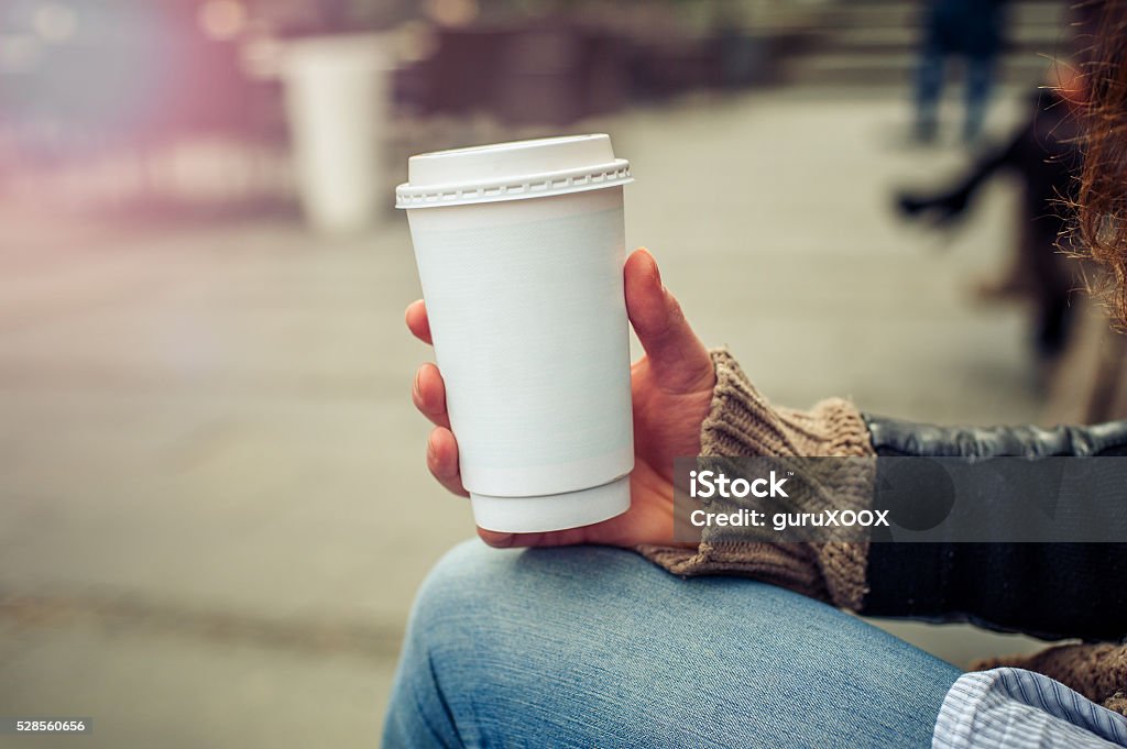 Coffee to go Woman drinking coffe on the street. Close up Coffee - Drink Stock Photo