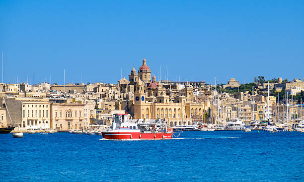 istock Passenger boat crosses Grand Bay, Valetta, Malta 528560690