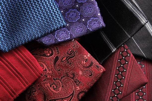 istock Rolled up silk ties on top of each other 528560699