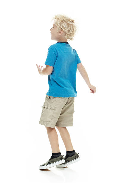 Rear view of little boy dancinghttp://www.twodozendesign.info/i/1.png