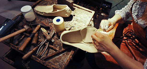 craftsman making luxury handmade man shoes