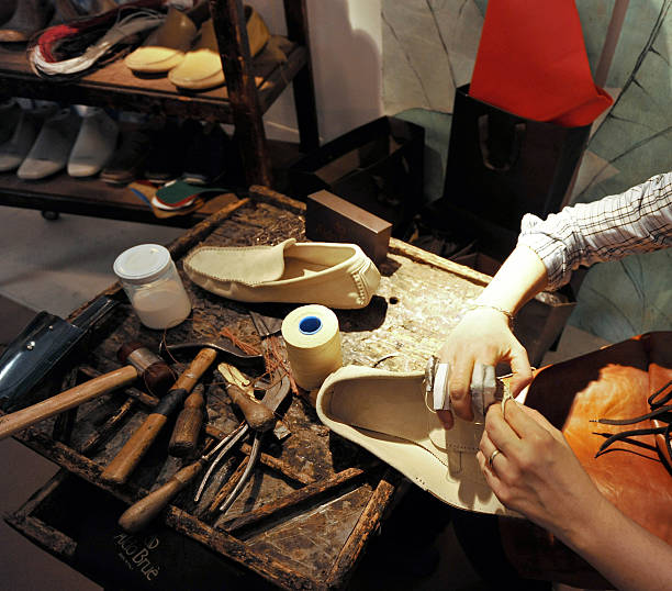 istock craftsman making luxury handmade man shoes 528561132