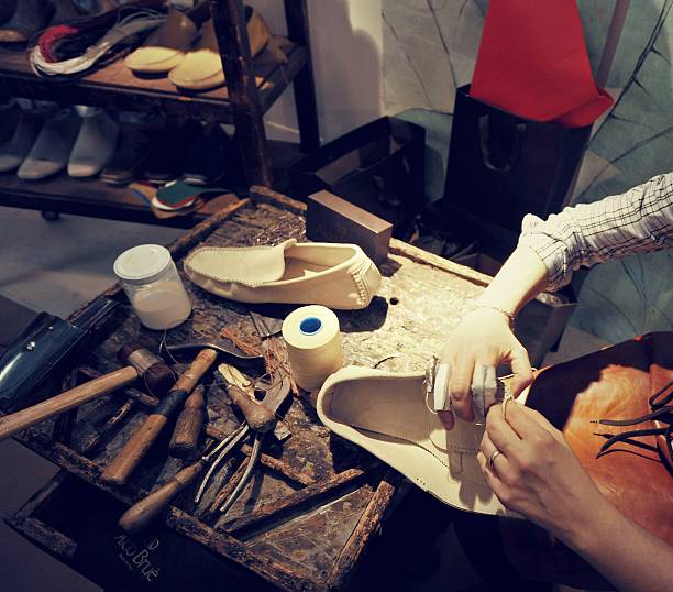 istock craftsman making luxury handmade man shoes 528561162