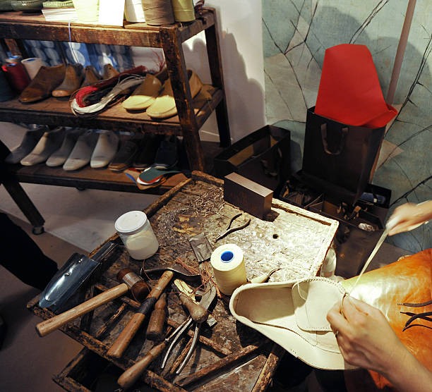 istock craftsman making luxury handmade man shoes 528561196