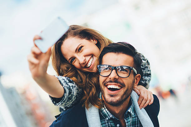 istock Happy couple making selfie outdoors 528561695