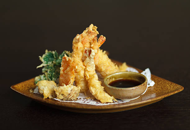 istock Tempura shrimps (deep fried shrimps) with soy sauce. 528561950