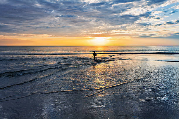 istock Child playing on the seashore 528562362