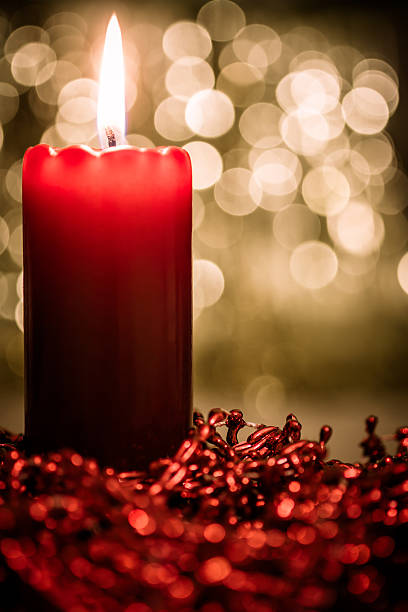 red candle stock photo