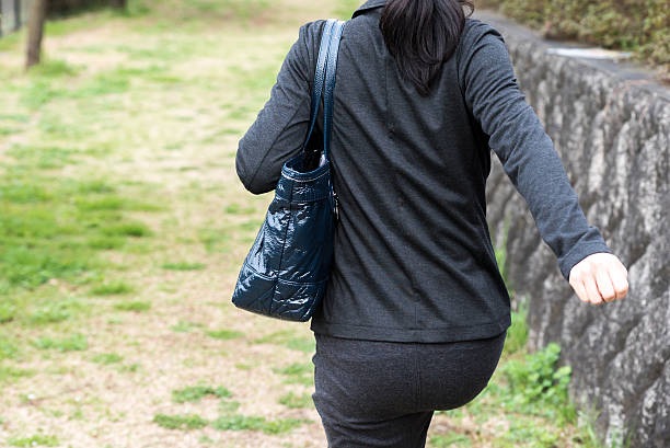 istock Asian business woman walking 528563804