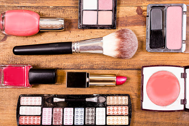 istock Various cosmetics, make-up lie on wooden dressing table. Knolling. 528563812