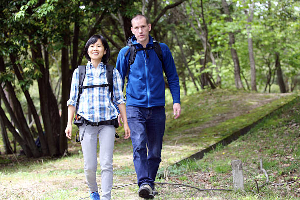 istock friends hiking in mountain 528564316