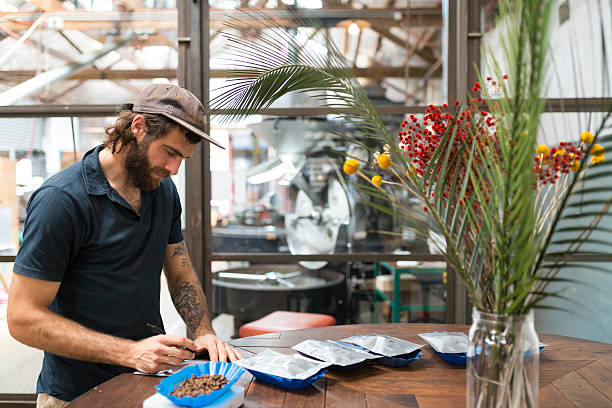 istock Man Working in Gourmet Coffee Roasting Factory 528564338