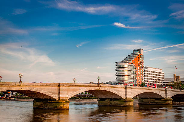 Putney bridge during day time Putney bridge is connecting Fulham to Putney across the river Thames, is the only bridge in britain to have a church at each end (St. Mary's Church, Putney to the south and All Saints Church, Fulham to the north) putney photos stock pictures, royalty-free photos & images