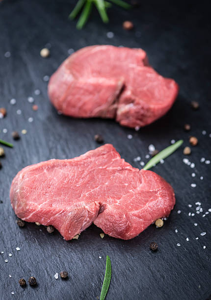 istock Slate slab with raw Beef Fillet 528564722