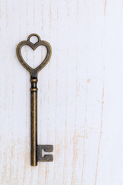 istock Heart shaped golden vintage key 528564838