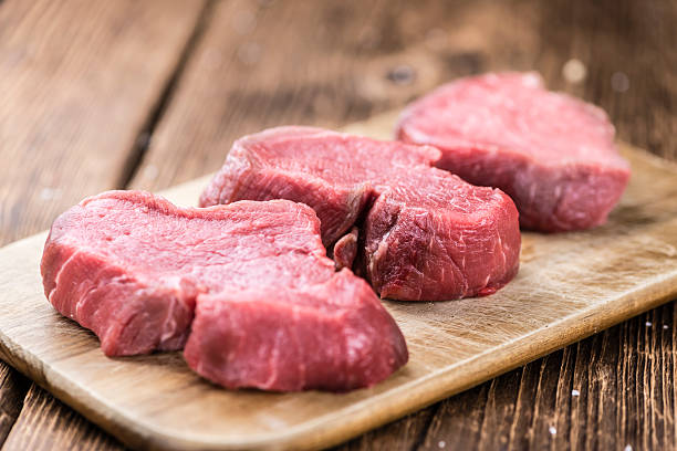istock Beef Fillet on wooden background 528565134