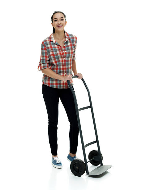 istock Smiling female holding hand truck 528568282