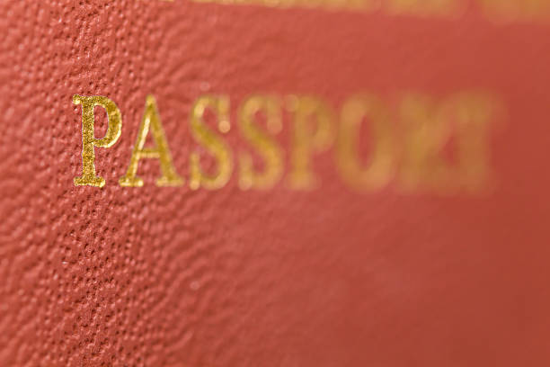 istock Macro passport with a red cover and gold lettering 528568442
