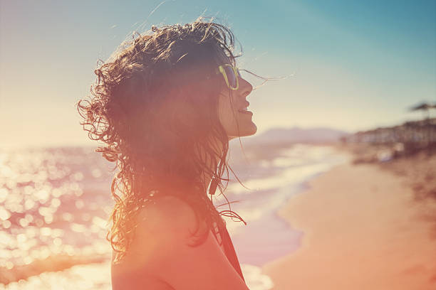 portrait of young beautiful woman on sunny summer day