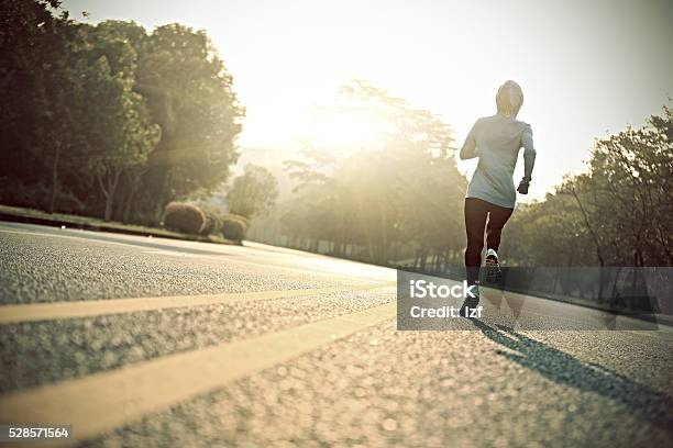 Young Fitness Woman Runner Athlete Running At Sunrise Road Stock Photo - Download Image Now
