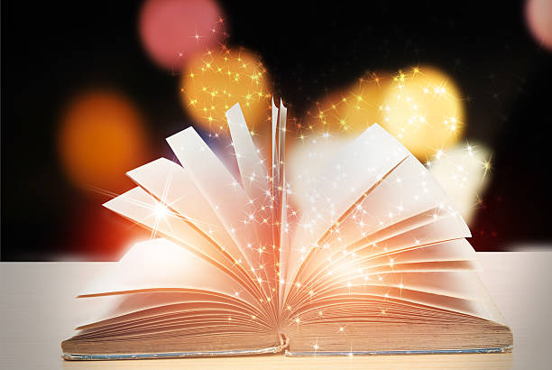istock Abstract magic book on wooden background 528574450