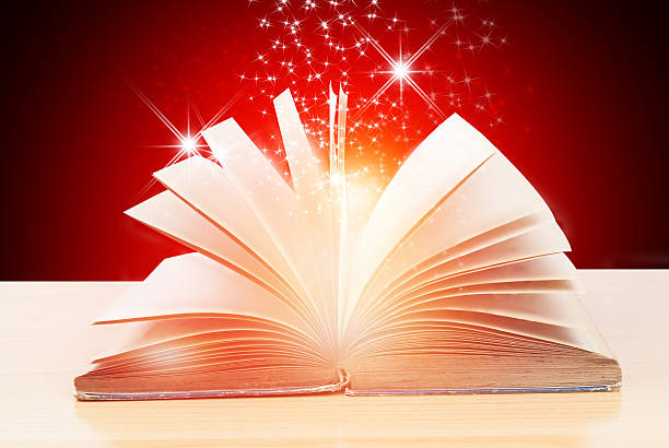 istock Abstract magic book on wooden background 528574558