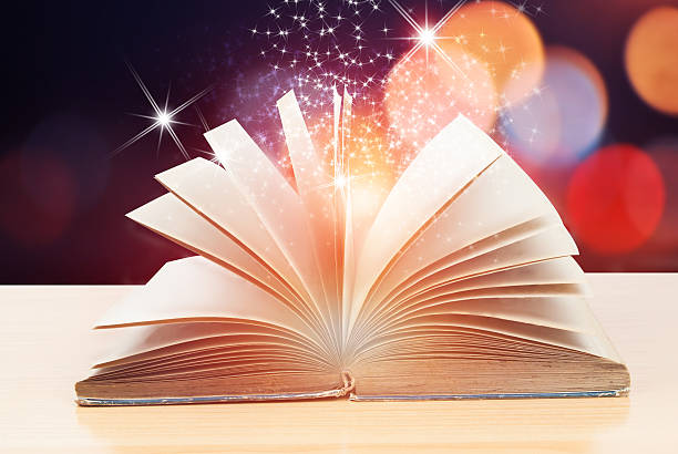 istock Abstract magic book on wooden background 528575044