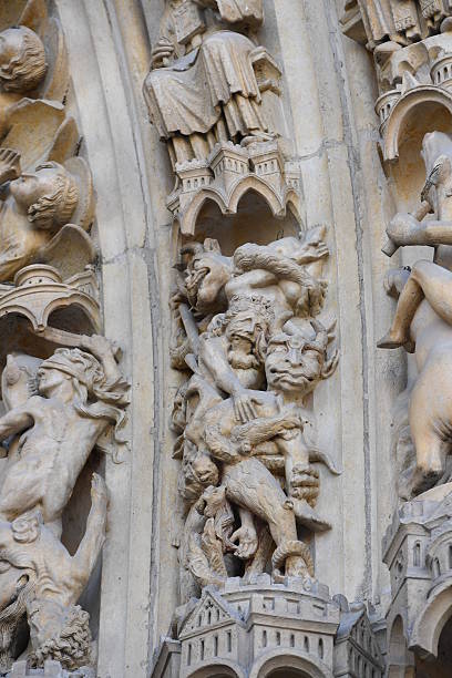 istock notre dame facade statue detail 528575316