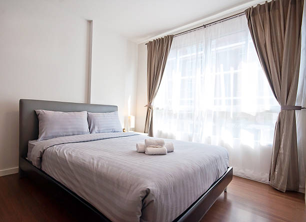 istock Luxurious bedroom with towels on the bed 528575952