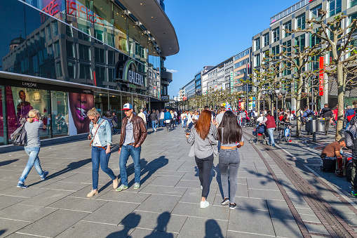 Frankfurt, Germany - May 6, 2016: people walk along the Zeil in Midday in Frankfurt, Germany. Since the 19th century it is of the most famous and busiest shopping streets in Germany.