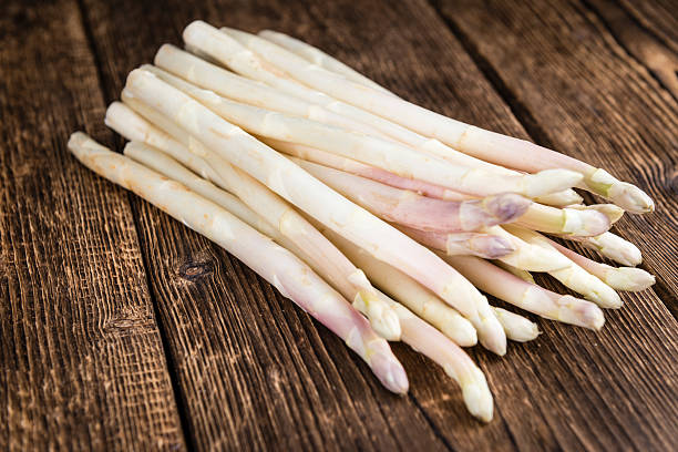 istock Portion of fresh white Asparagus (close-up shot) 528578356